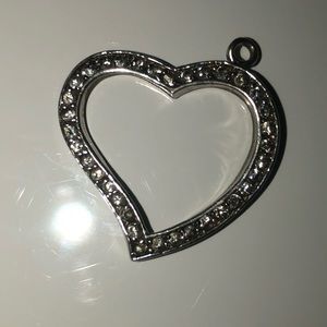 Sterling silver heart charm with cz stones.